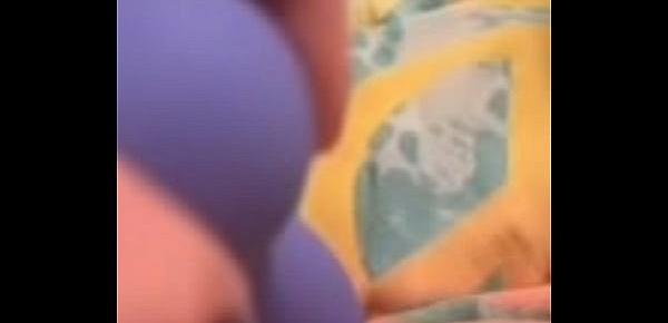  Horny babe uses purple dildo